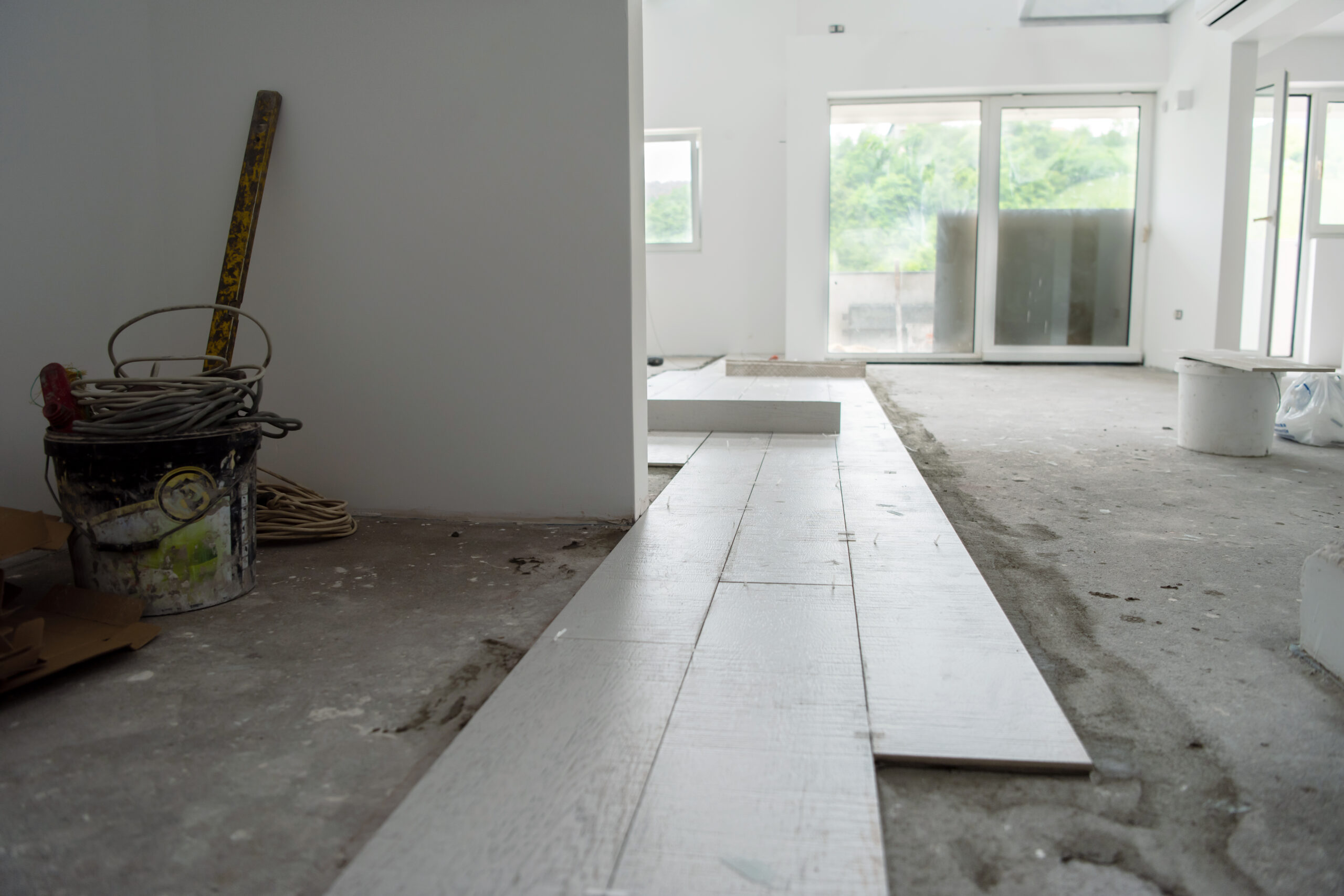 Ceramic wood effect tiles and tools for tiler on the floor  unfinished laying floor tiles  Floor tiles installation